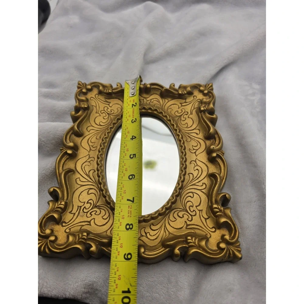 Vintage Oval Mirror In An Ornate Gold Victorian/Hollywood Regency Plastic Frame